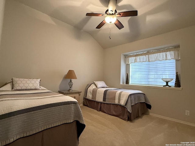 bedroom featuring vaulted ceiling, a ceiling fan, baseboards, and carpet floors