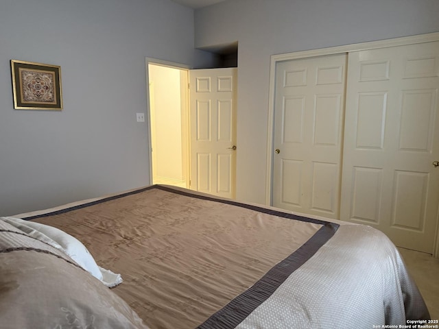 bedroom featuring a closet and baseboards