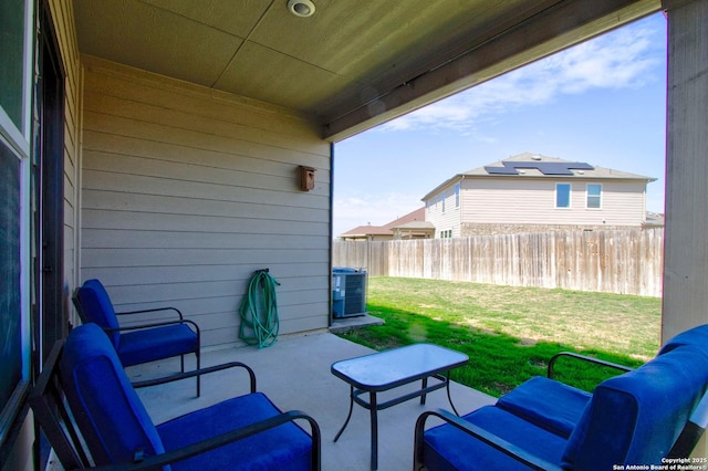 view of patio / terrace with an outdoor hangout area, central AC, and fence