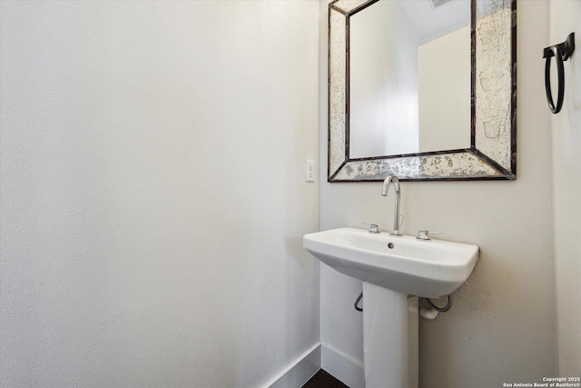 bathroom featuring baseboards