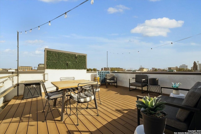 wooden deck featuring outdoor dining space