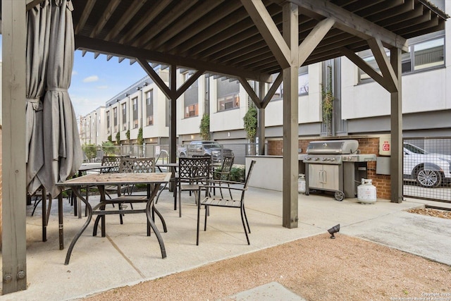 view of patio featuring a grill