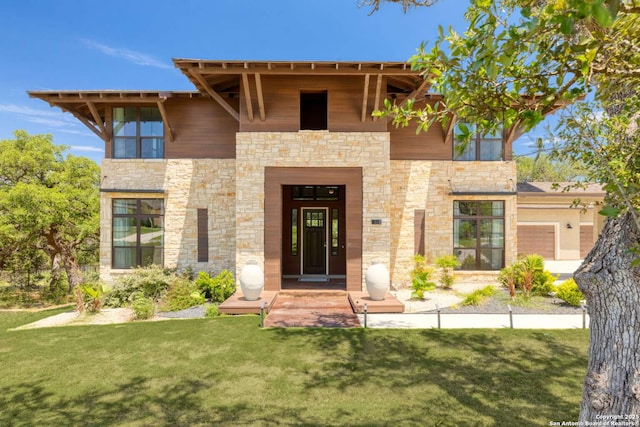 contemporary house featuring a front lawn