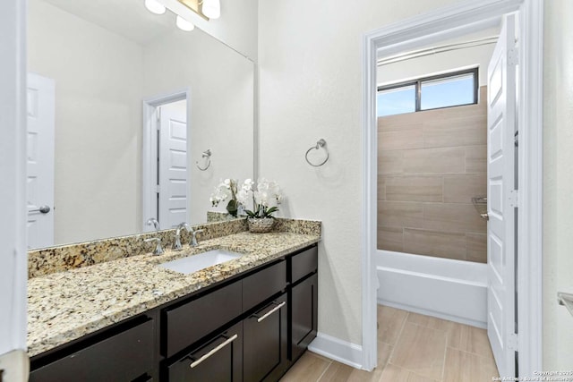 bathroom with vanity and baseboards