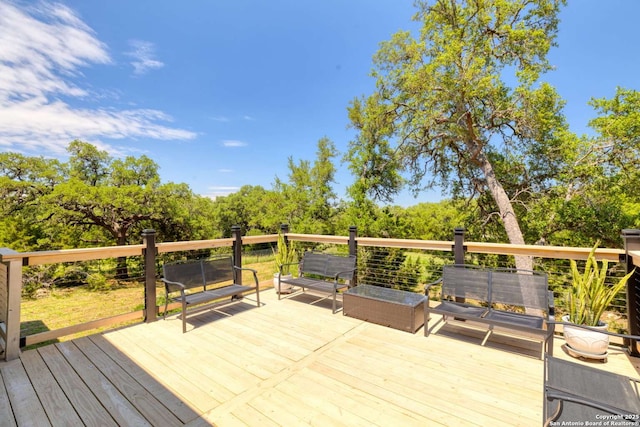 wooden terrace featuring an outdoor living space