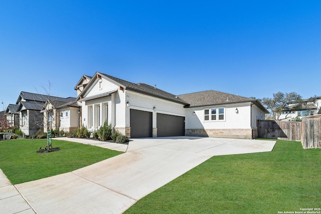 view of front of property with stucco siding, stone siding, fence, a front yard, and a garage