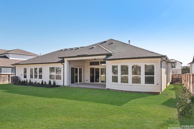 back of property featuring a patio, a fenced backyard, cooling unit, a yard, and a shingled roof