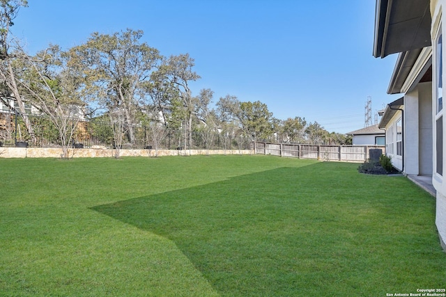 view of yard with a fenced backyard