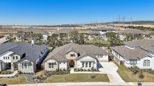 birds eye view of property with a residential view