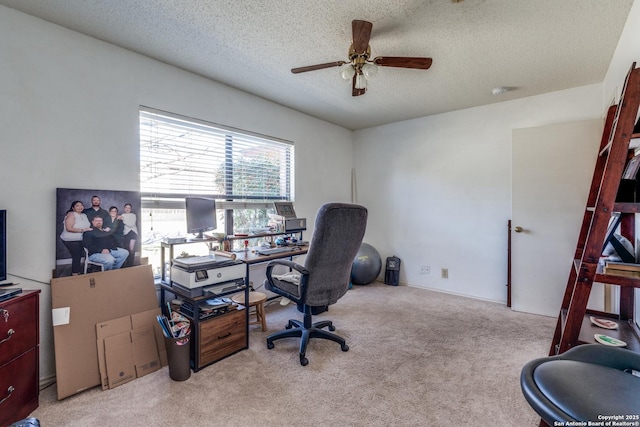 office with light colored carpet, a textured ceiling, and ceiling fan