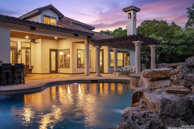 133 Fair Spgs, Boerne, TX 78006 - back of house featuring a pergola, stucco siding, a tiled roof, ceiling fan, and a patio area
