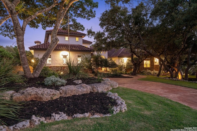 133 Fair Spgs, Boerne, TX 78006 - view of front of property with stucco siding, a tiled roof, and a yard
