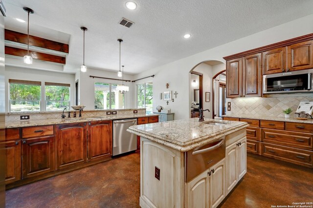 133 Fair Spgs, Boerne, TX 78006 - kitchen with stainless steel appliances, concrete flooring, a warming drawer, a sink, and recessed lighting