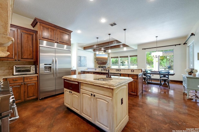 133 Fair Spgs, Boerne, TX 78006 - kitchen featuring appliances with stainless steel finishes, an island with sink, concrete flooring, a warming drawer, and recessed lighting