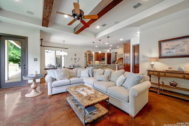 133 Fair Spgs, Boerne, TX 78006 - living area with concrete floors, a ceiling fan, beam ceiling, a chandelier, and arched walkways