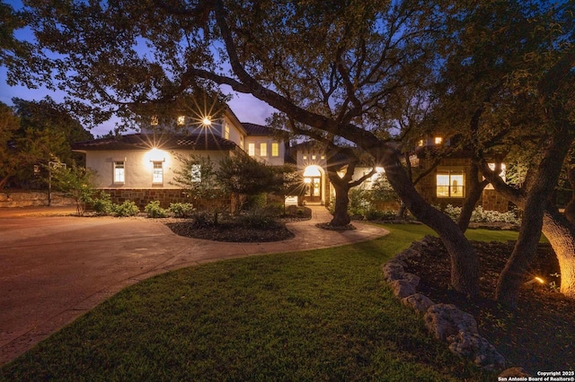 133 Fair Spgs, Boerne, TX 78006 - view of front of house featuring a front yard, stucco siding, and concrete driveway