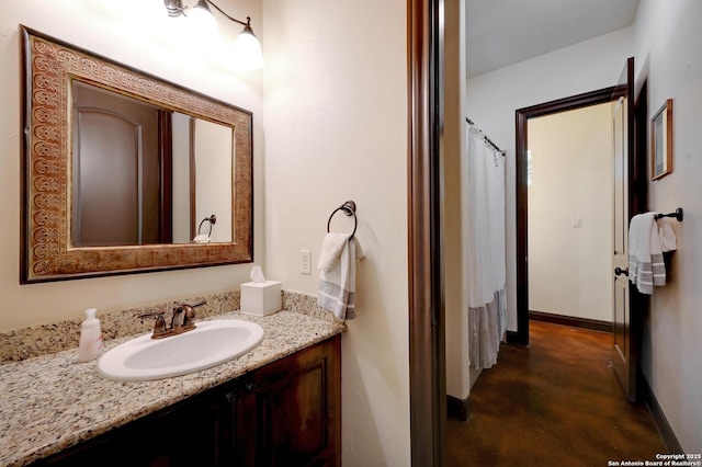 133 Fair Spgs, Boerne, TX 78006 - bathroom featuring concrete floors, vanity, and baseboards