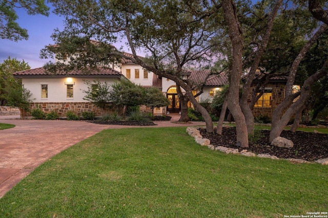 133 Fair Spgs, Boerne, TX 78006 - mediterranean / spanish-style house with a tile roof, a front yard, and stucco siding