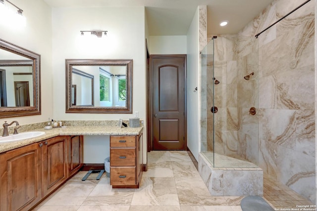 133 Fair Spgs, Boerne, TX 78006 - full bathroom with a marble finish shower, vanity, and marble look tile flooring