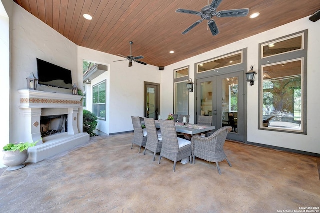 133 Fair Spgs, Boerne, TX 78006 - view of patio / terrace featuring an outdoor fireplace, a ceiling fan, outdoor dining space, and french doors