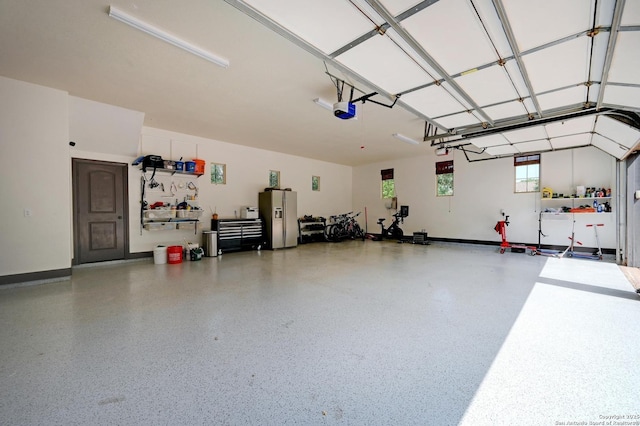 133 Fair Spgs, Boerne, TX 78006 - garage featuring stainless steel fridge and a garage door opener