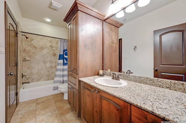 133 Fair Spgs, Boerne, TX 78006 - bathroom featuring vanity, toilet, shower / bath combination with curtain, and stone finish flooring