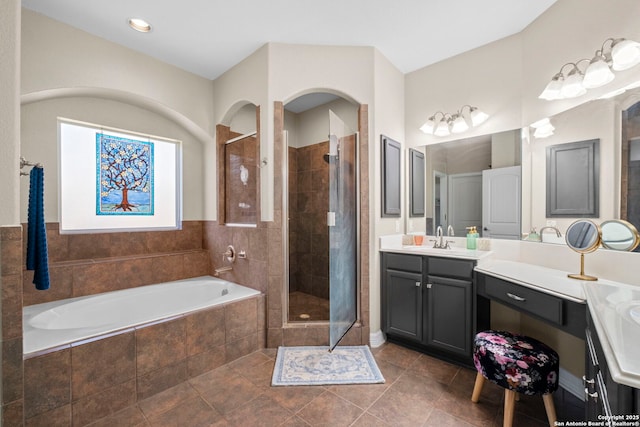 full bath with vanity, a shower stall, a bath, and tile patterned floors