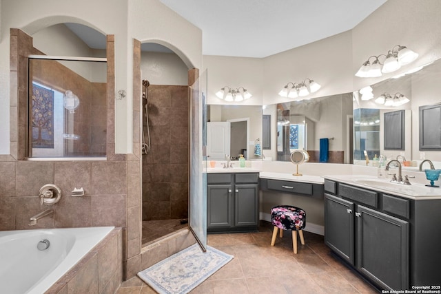 full bathroom with vanity, tile patterned floors, tiled bath, and a tile shower