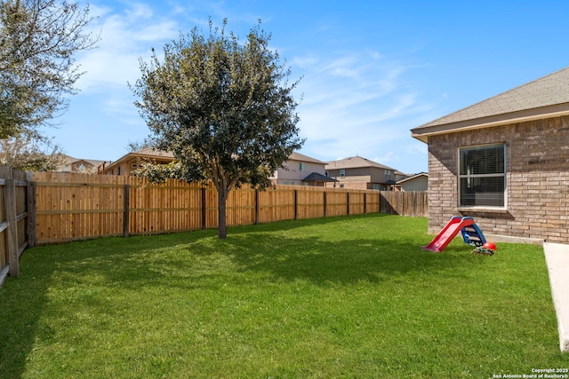 view of yard with a fenced backyard