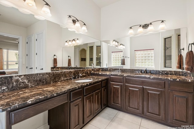 full bathroom featuring tile patterned floors and vanity