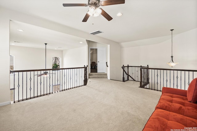 living area featuring a ceiling fan, carpet flooring, recessed lighting, and visible vents