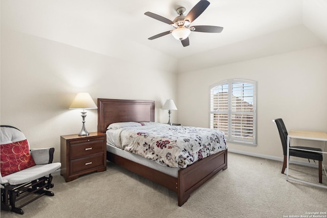 bedroom featuring a ceiling fan, light colored carpet, and baseboards