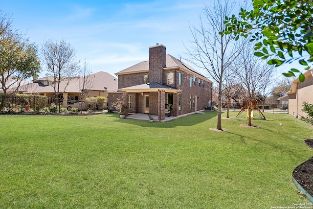 view of yard with a patio, central AC unit, and a fenced backyard