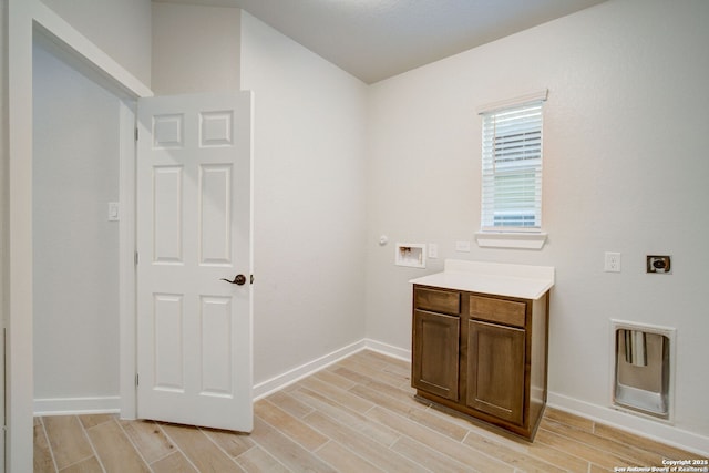 bathroom with vanity, baseboards, and wood finish floors