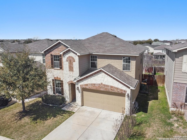 traditional home with fence, a shingled roof, concrete driveway, a garage, and stone siding