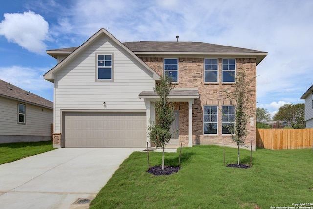 traditional-style home with brick siding, concrete driveway, a front lawn, and fence