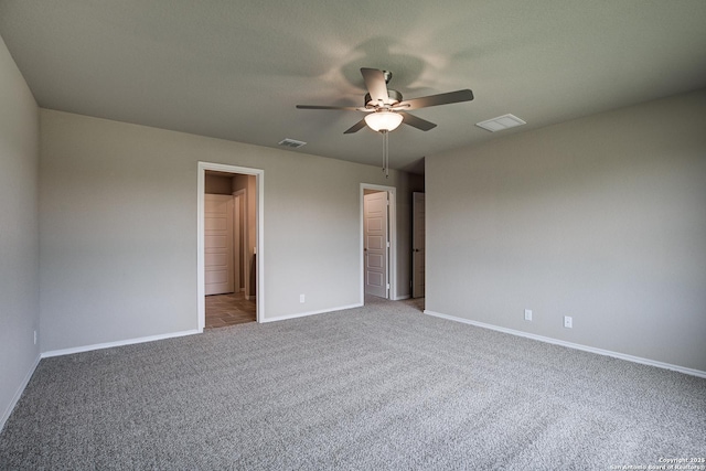 unfurnished bedroom featuring visible vents, baseboards, and carpet