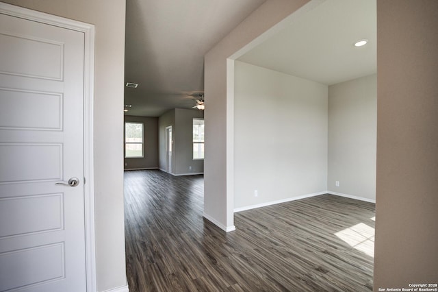 spare room with ceiling fan, baseboards, dark wood-style floors, and recessed lighting