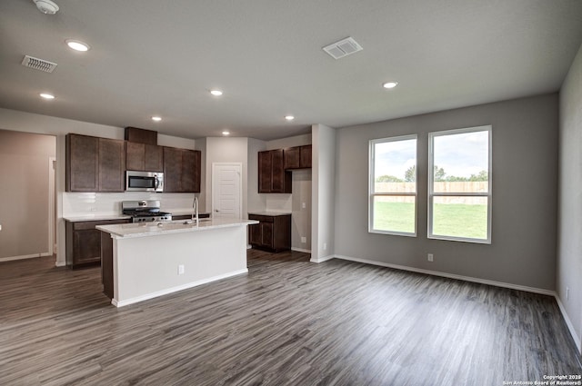 kitchen featuring dark wood-style floors, visible vents, and appliances with stainless steel finishes