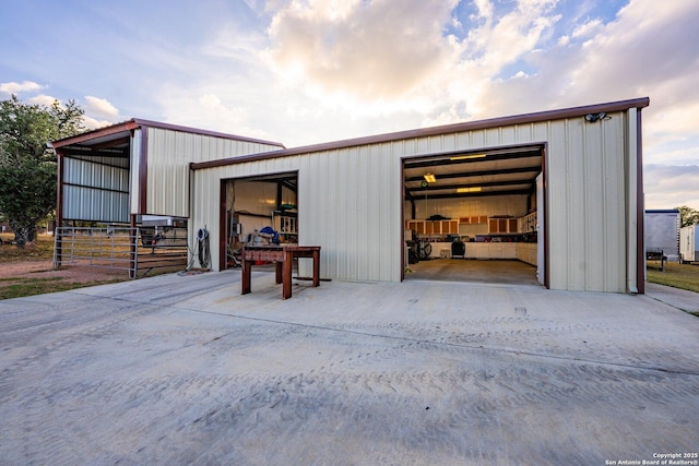 detached garage with concrete driveway