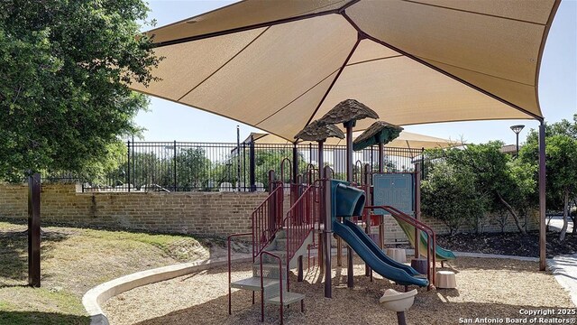 community jungle gym with fence