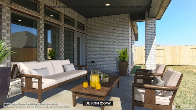view of patio / terrace featuring an outdoor living space and fence