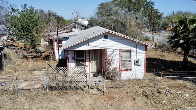 view of outbuilding featuring fence