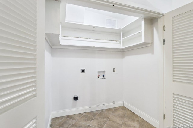 washroom featuring baseboards, hookup for an electric dryer, hookup for a washing machine, and laundry area