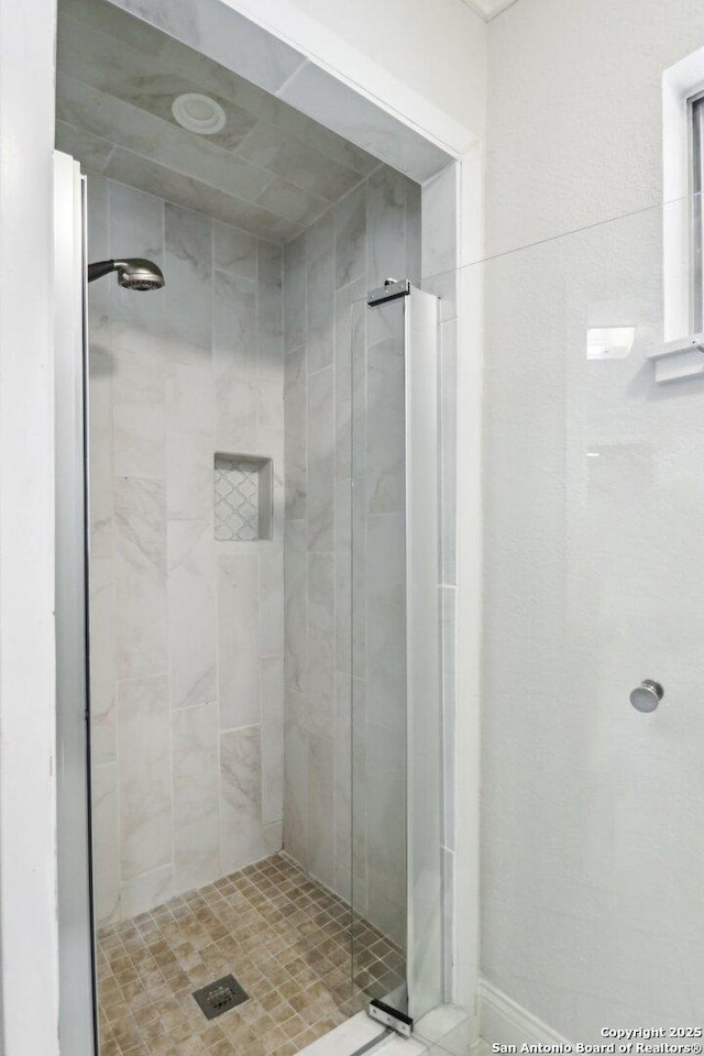 full bathroom with a stall shower