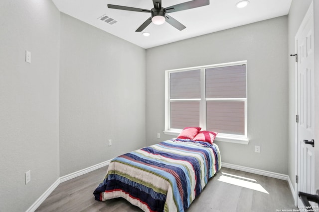 650 Canyon Cir, Canyon Lake, TX 78133 - bedroom with wood finished floors, baseboards, recessed lighting, and a ceiling fan