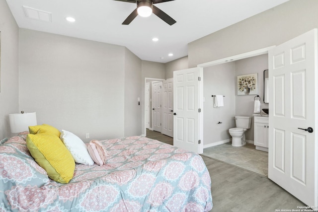 650 Canyon Cir, Canyon Lake, TX 78133 - bedroom with light wood-style flooring, ensuite bathroom, recessed lighting, baseboards, and ceiling fan