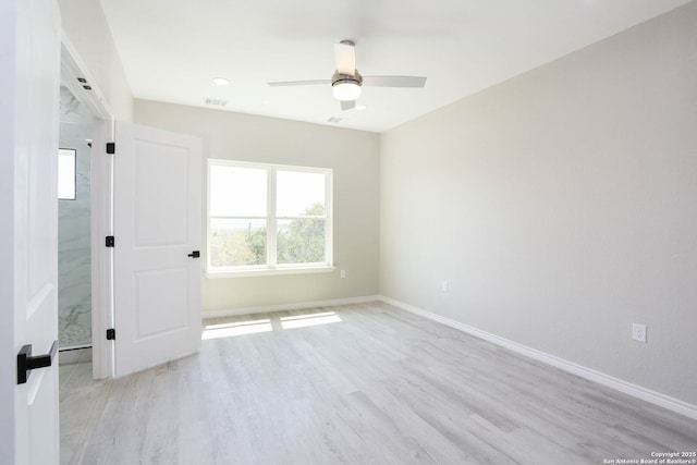 unfurnished bedroom with visible vents, light wood-style flooring, ceiling fan, and baseboards
