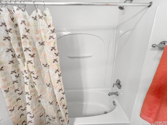 full bathroom with shower / bath combo with shower curtain