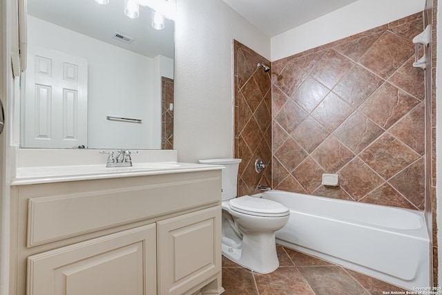 bathroom with visible vents, vanity, toilet, and shower / tub combination